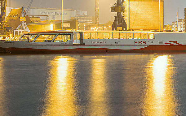 Vessel in the shipyard of Stralsund in the evening lights.