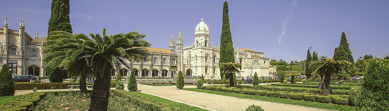 View on the Mosteiro dos Jerónimos or Belem Monastery from the green garden.