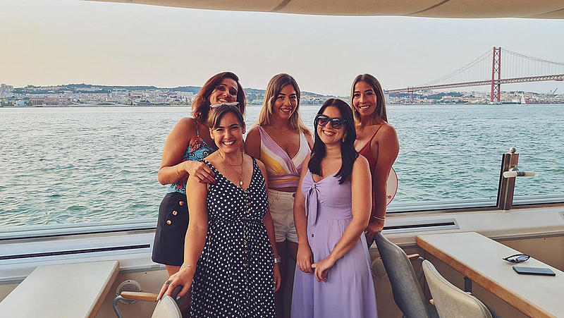 FRS Portugal sunset cruise group of girls in front of ponte abril 25