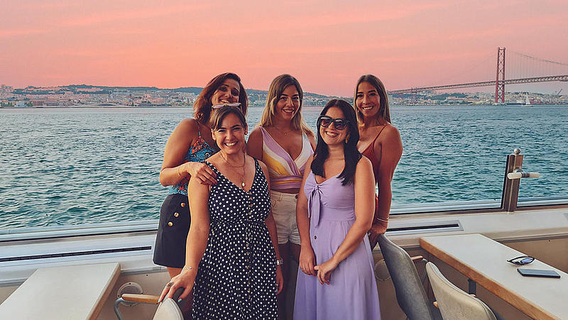 FRS Portugal sunset cruise group of girls in front of ponte abril 25