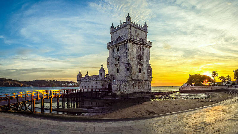 The Belém Tower at sunset from the promenade.