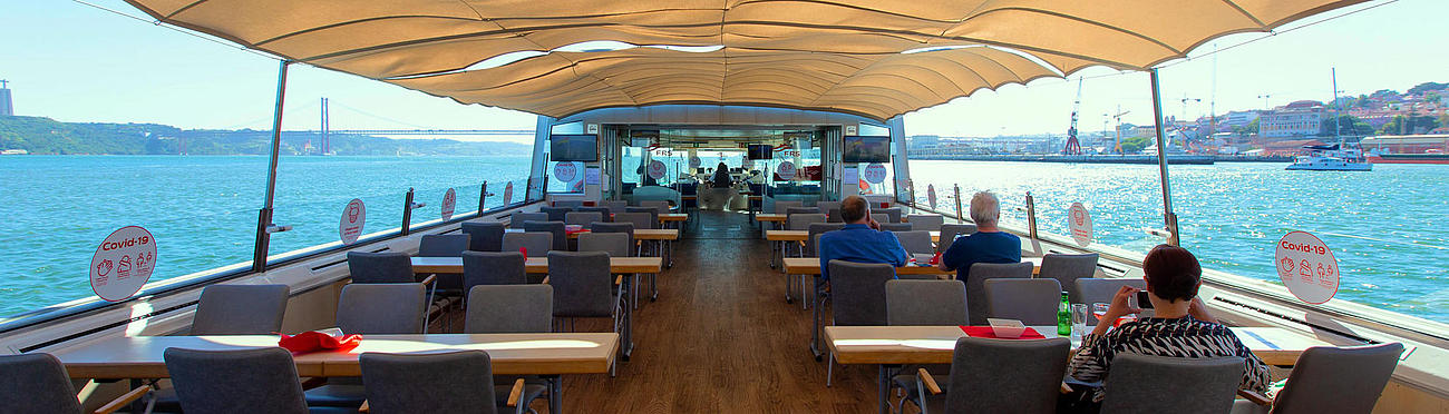 View from the interior of the boat with the sun awning extended.