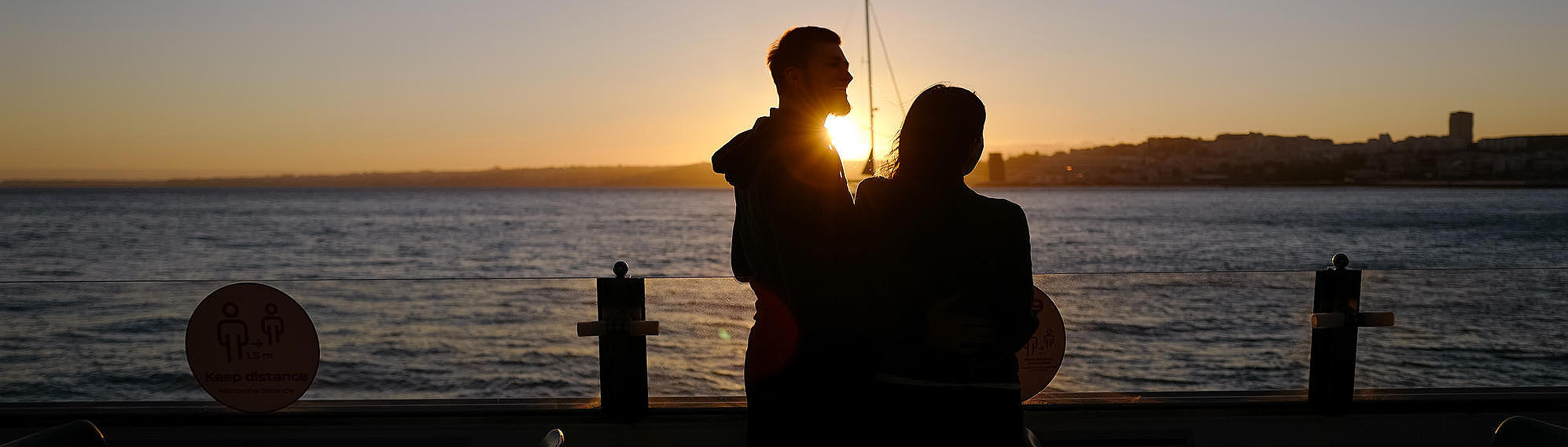 A couple enjoys the sunset on a FRS Portugal ship