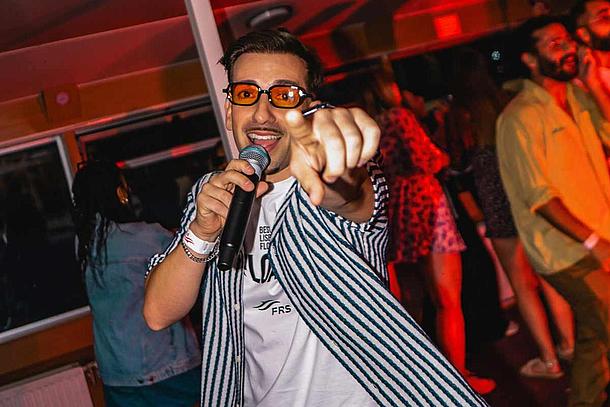 MC Márcio Jesus hyping up the crowd at Love Float - Lisboa Boat Party