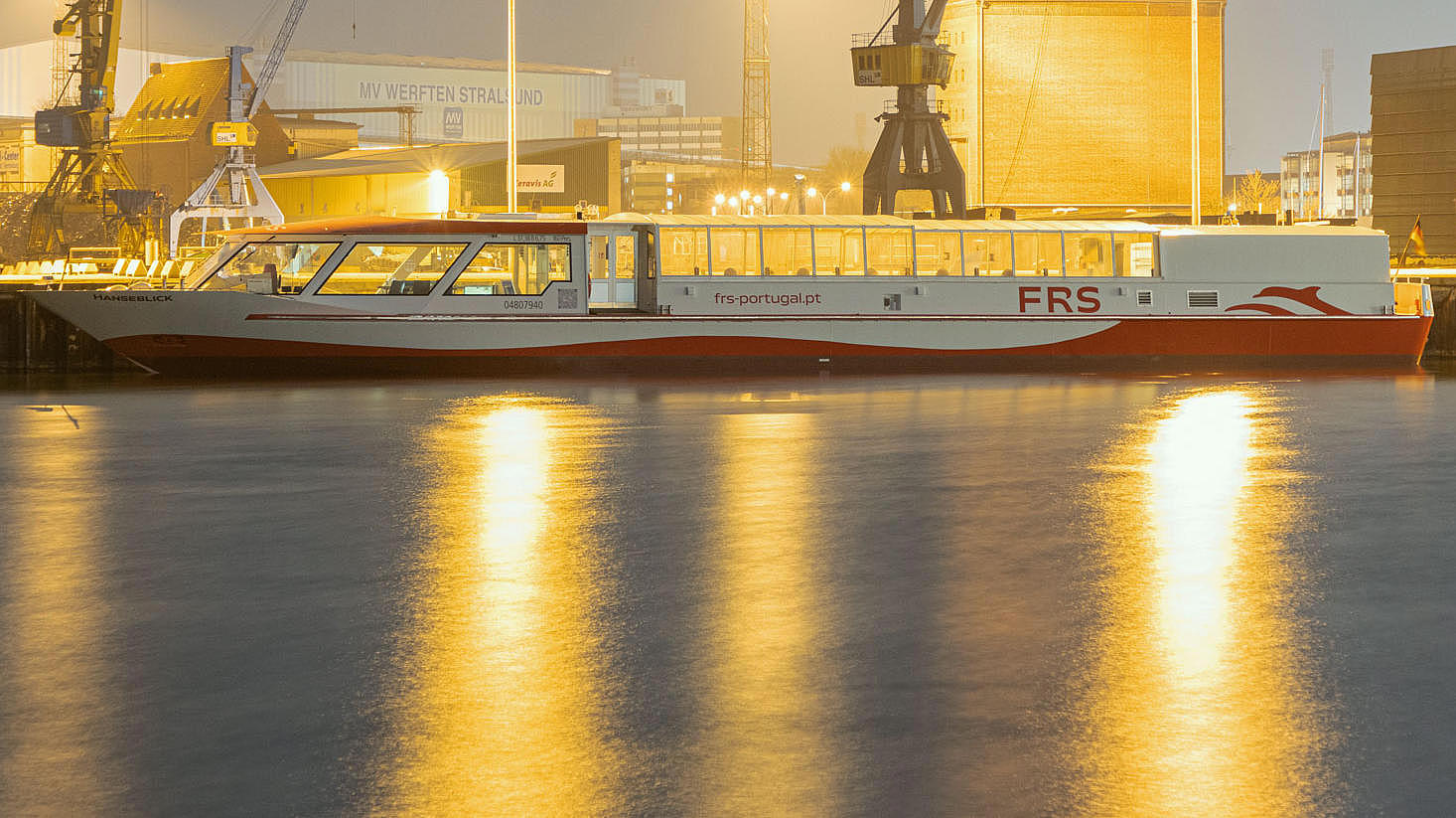 Vessel in the shipyard of Stralsund in the evening lights.