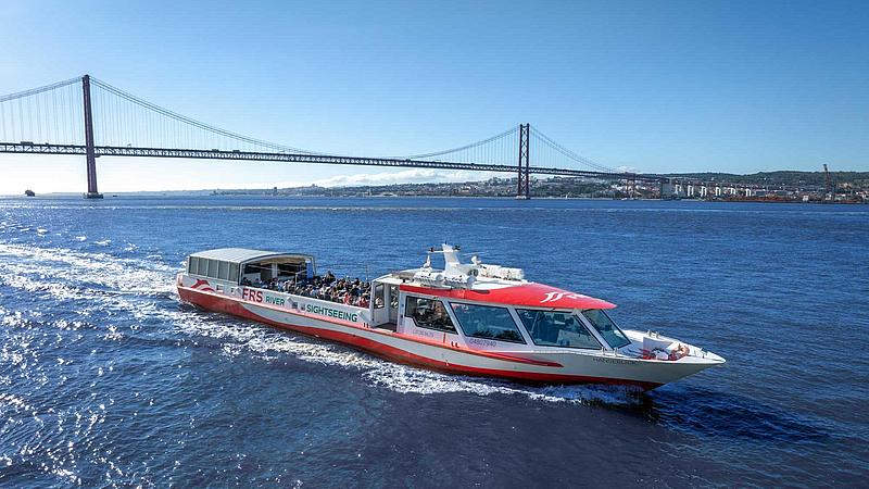 A boat on a river under the blue sky