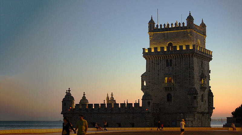The Belém Tower at night and subtly illuminated.